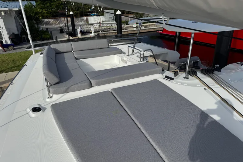 Slide: The Image of Luxurious 2026 Lagoon 43 yacht deck with comfortable gray seating and modern design. - 4