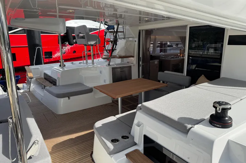 Slide: The Image of Luxurious Lagoon 43 yacht interior, featuring modern seating and dining area, 2026 model. - 8