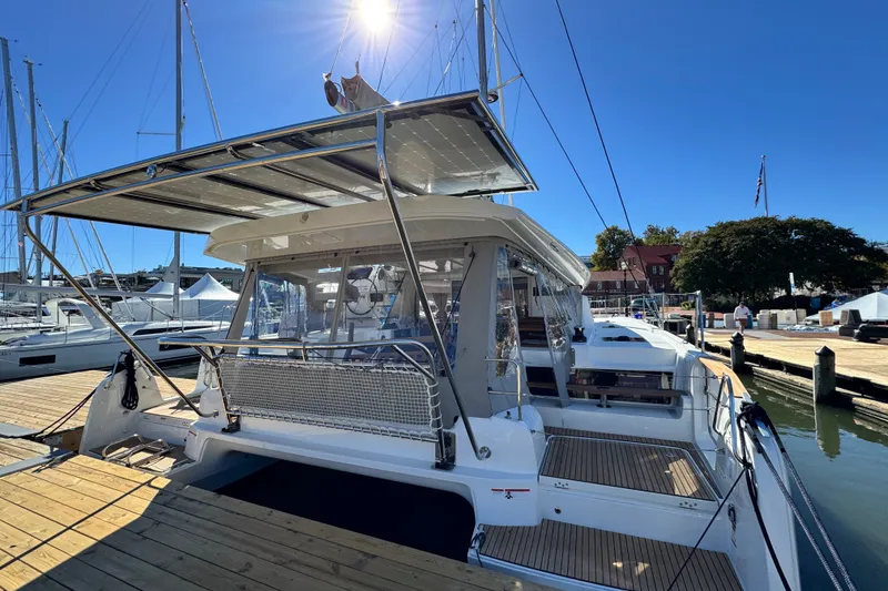 Slide: The Image of 2026 Lagoon 43 catamaran docked under clear blue sky. - 3