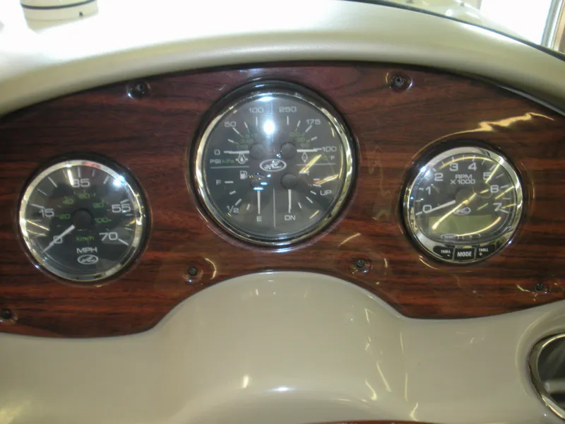Slide: The Image of Dashboard of a 2007 Sea Ray 220 Sundeck with speedometer and RPM gauges. - 10