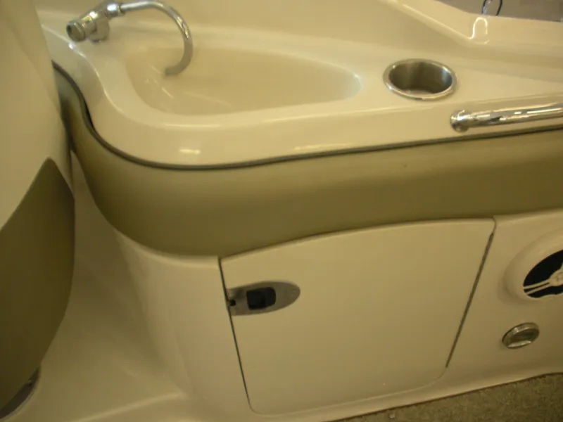 Slide: The Image of 2007 Sea Ray 220 Sundeck interior sink and storage compartment. - 20