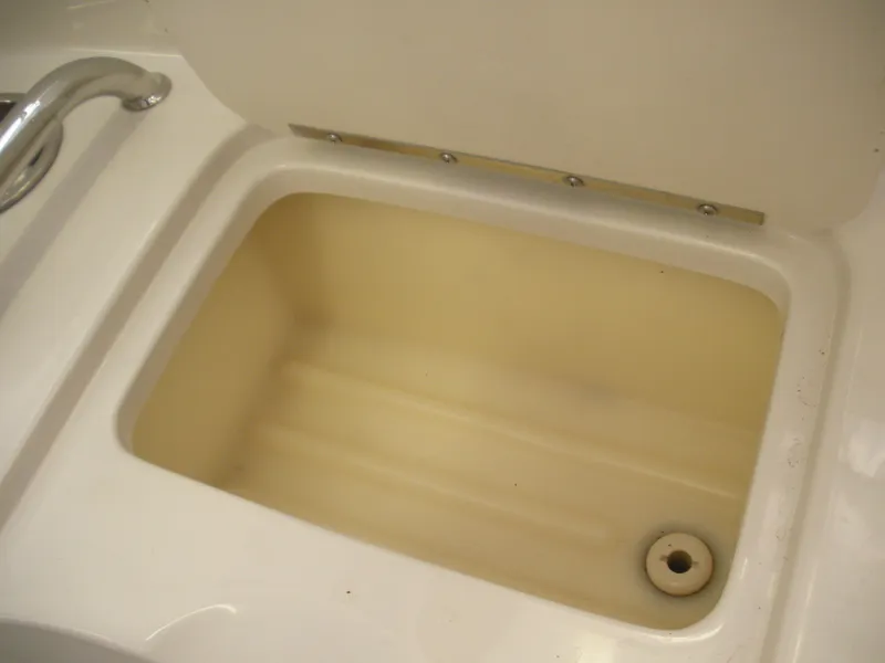 Slide: The Image of Open storage compartment on a 2007 Sea Ray 220 Sundeck boat. - 23