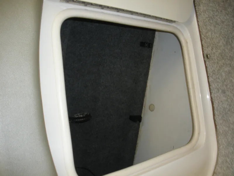 Slide: The Image of Storage compartment in a 2007 Sea Ray 220 Sundeck boat. - 27