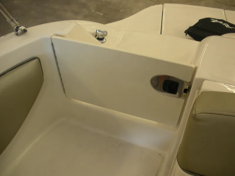 Slide: The Image of 2007 Sea Ray 220 Sundeck interior detail with seating and storage compartment. - 29