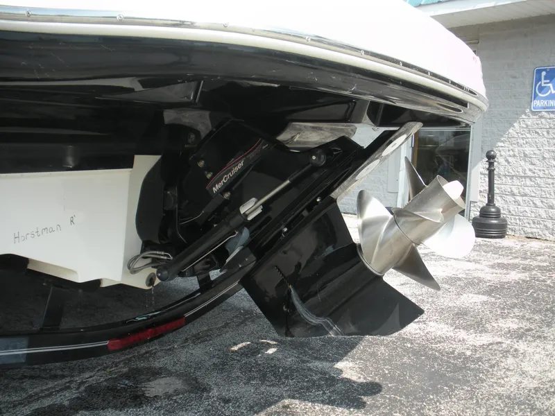 Slide: The Image of 2007 Sea Ray 220 Sundeck boat propeller and outdrive close-up. - 32