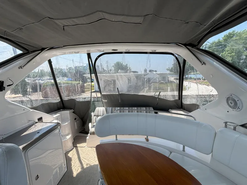 Slide: The Image of Interior of 2006 Regal Commodore 3560 IO yacht with seating and table. - 10