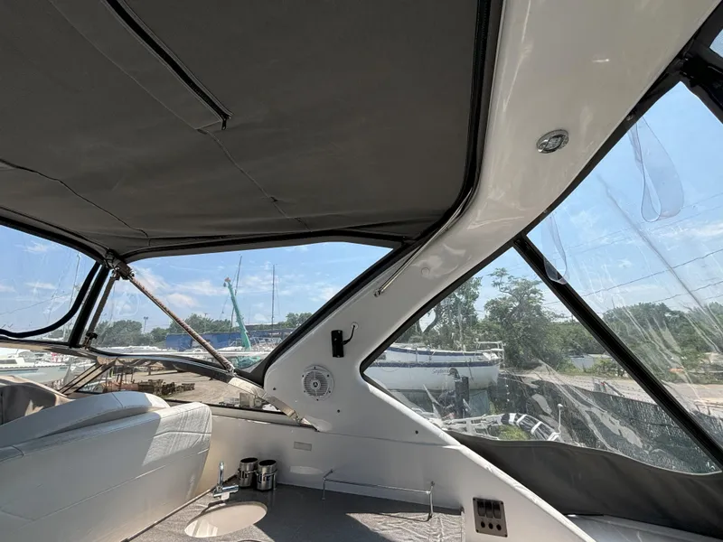 Slide: The Image of Interior view of 2006 Regal Commodore 3560 IO yacht with clear windows and seating area. - 16