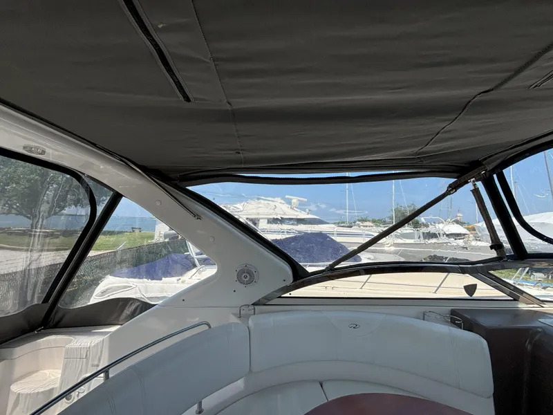 Slide: The Image of Interior view of 2006 Regal Commodore 3560 IO yacht with marina background. - 18