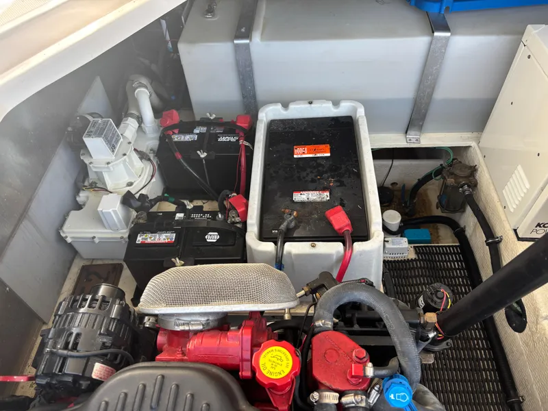 Slide: The Image of Engine compartment of 2006 Regal Commodore 3560 IO with batteries and mechanical components. - 28