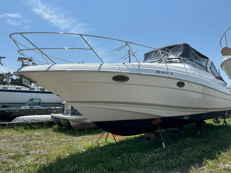 Slide: The Image of 2006 Regal Commodore 3560 IO boat on land, sunny day, clear sky. - 33