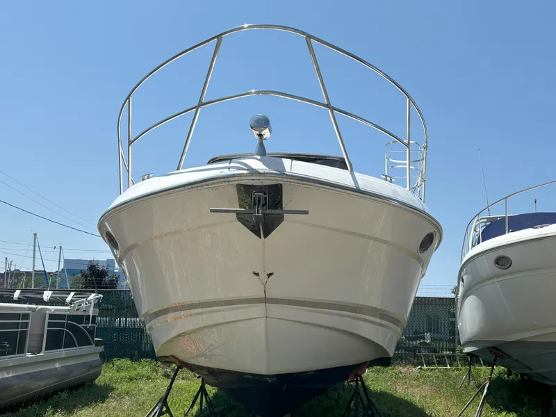 Slide: The Image of 2006 Regal Commodore 3560 IO boat on display, front view, sunny day. - 34