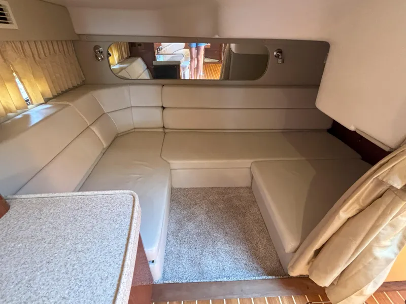 Slide: The Image of Interior of 2006 Regal Commodore 3560 IO yacht with beige seating and carpet. - 35