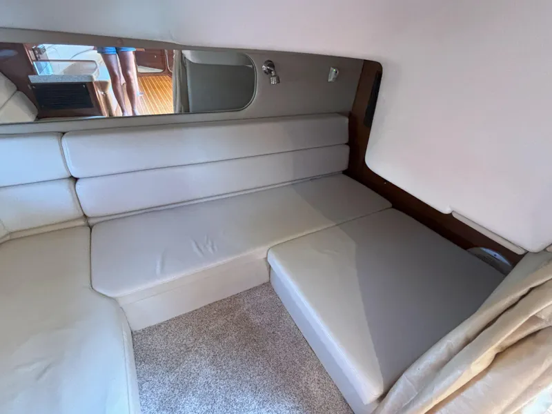 Slide: The Image of Interior of 2006 Regal Commodore 3560 IO yacht with beige seating and carpet. - 37