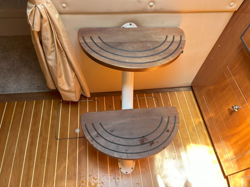 Slide: The Image of Wooden steps inside a 2006 Regal Commodore 3560 IO boat cabin. - 38