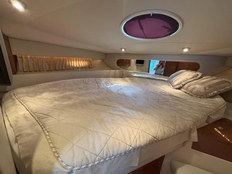 Slide: The Image of Luxurious cabin interior of 2006 Regal Commodore 3560 IO yacht with cozy bedding. - 4