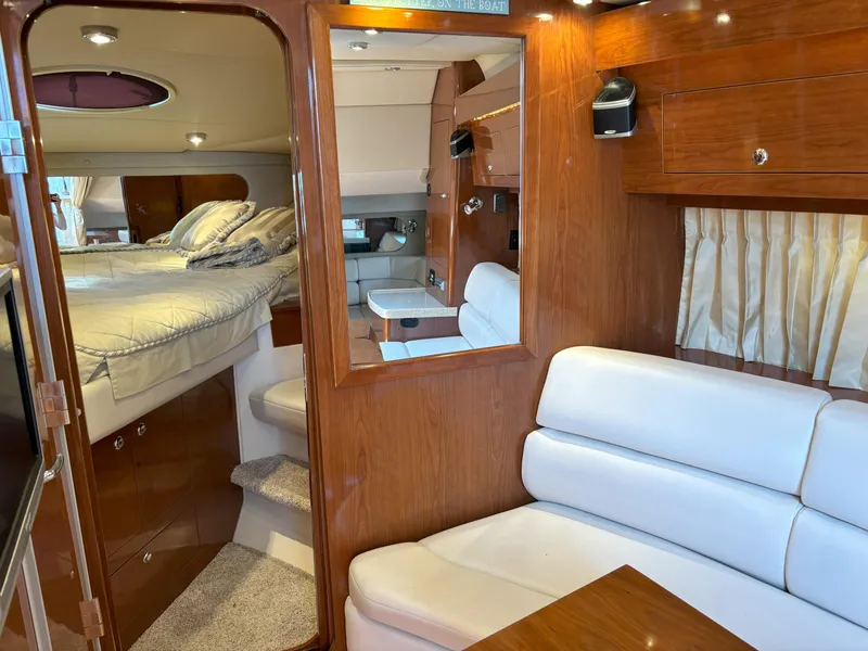 Slide: The Image of Interior of 2006 Regal Commodore 3560 IO yacht with cozy seating and elegant wood finish. - 43