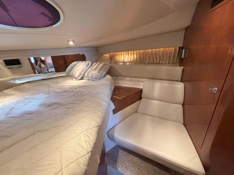 Slide: The Image of Luxurious cabin interior of 2006 Regal Commodore 3560 IO yacht with bed and seating area. - 5