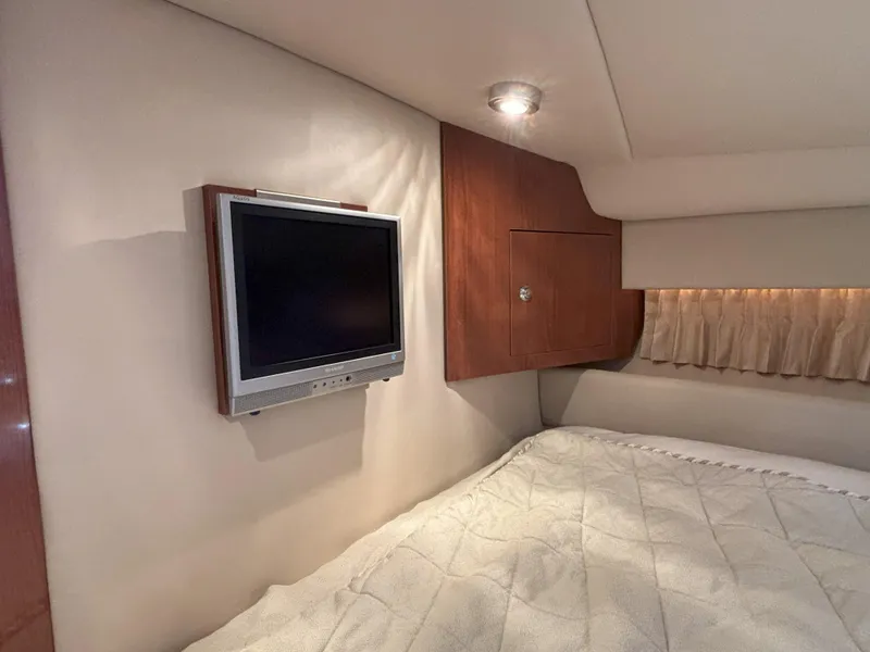 Slide: The Image of Interior of 2006 Regal Commodore 3560 IO with TV and cozy bed. - 6