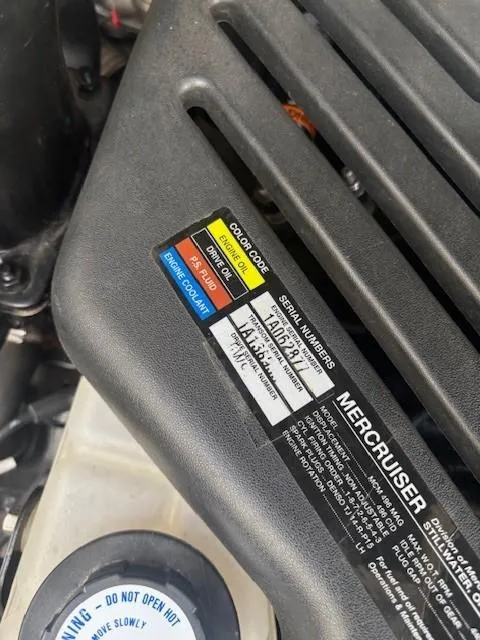 Slide: The Image of Engine cover of a 2008 Sea Ray 270 Amberjack with MerCruiser label and color-coded maintenance guide. - 14