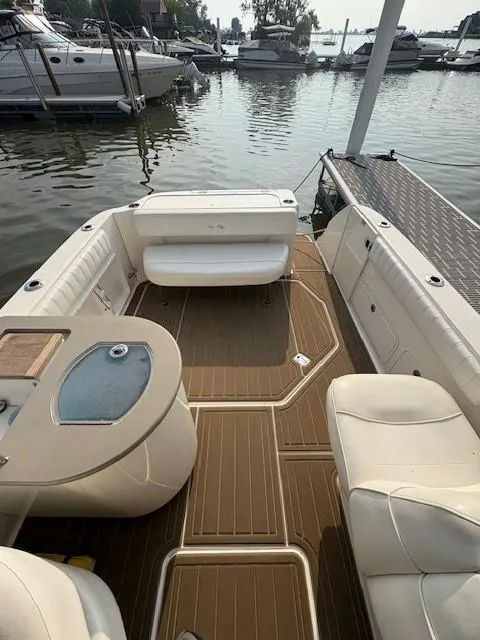 Slide: The Image of 2008 Sea Ray 270 Amberjack boat interior with seating and water view. - 7