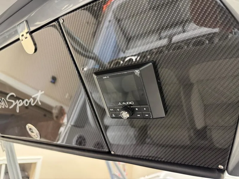 Slide: The Image of 2024 Nor-Tech 390 Sport Center Console with JL Audio system and carbon fiber finish. - 17