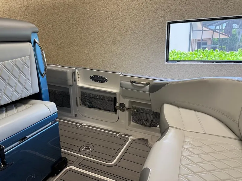 Slide: The Image of 2024 Nor-Tech 390 Sport Center Console interior with luxurious seating and modern design. - 19