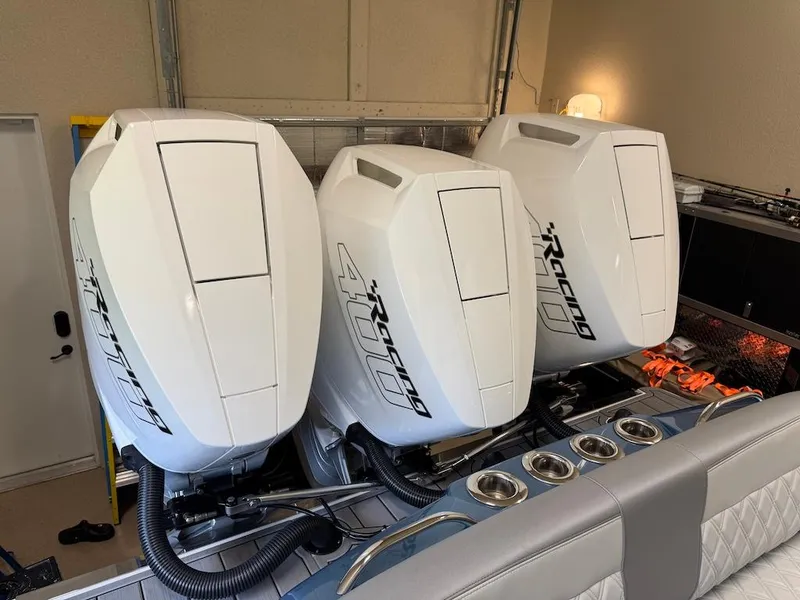 Slide: The Image of Triple outboard engines on a 2024 Nor-Tech 390 Sport Center Console boat. - 20