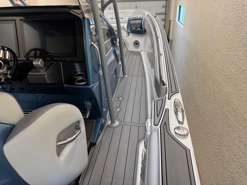 Slide: The Image of 2024 Nor-Tech 390 Sport Center Console interior with sleek design and modern controls. - 27
