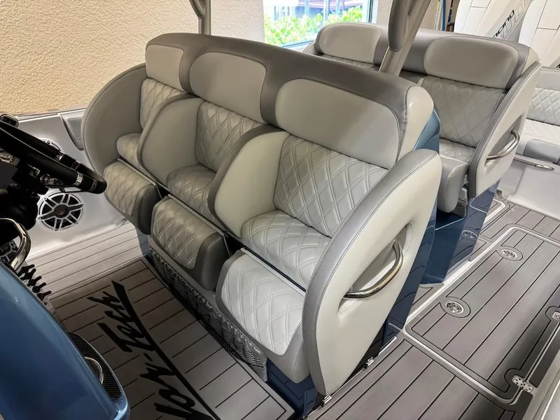 Slide: The Image of 2024 Nor-Tech 390 Sport Center Console interior with luxurious seating and modern design. - 3