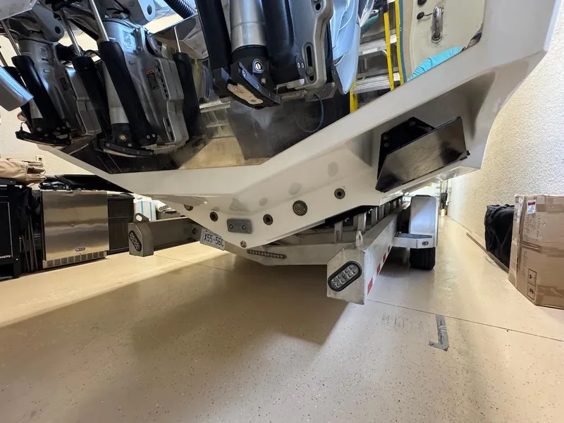 Slide: The Image of 2024 Nor-Tech 390 Sport Center Console on trailer, showcasing powerful outboard engines. - 31