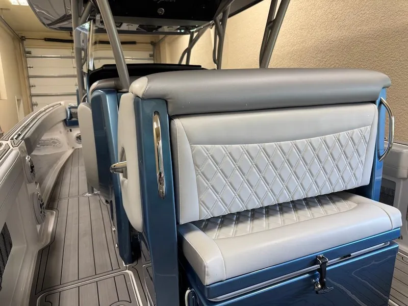 Slide: The Image of 2024 Nor-Tech 390 Sport Center Console interior with diamond-stitched seating and sleek design. - 4
