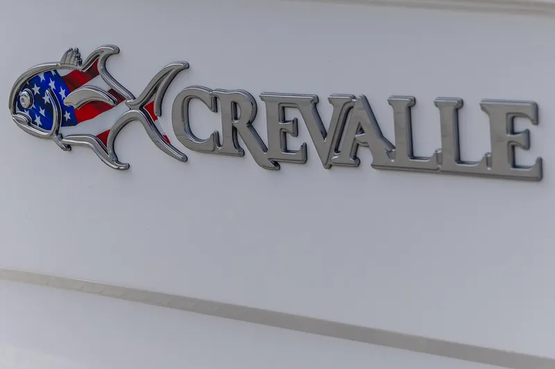 Slide: The Image of Crevalle 24 HCO 2025 logo with American flag fish design on boat exterior. - 12