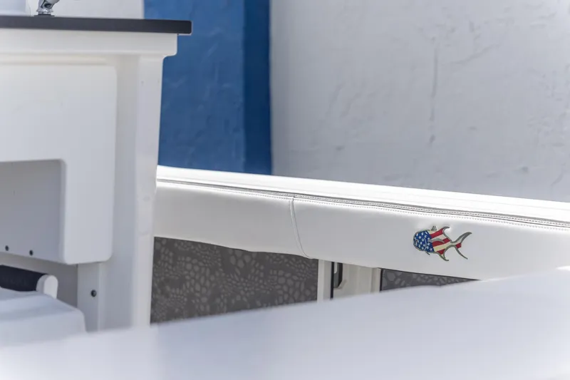 Slide: The Image of 2025 Crevalle 24 HCO boat interior with American flag fish emblem. - 14
