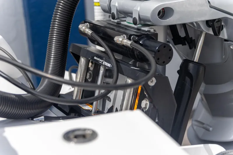 Slide: The Image of Close-up of 2025 Crevalle 24 HCO boat engine components and hydraulic system. - 17
