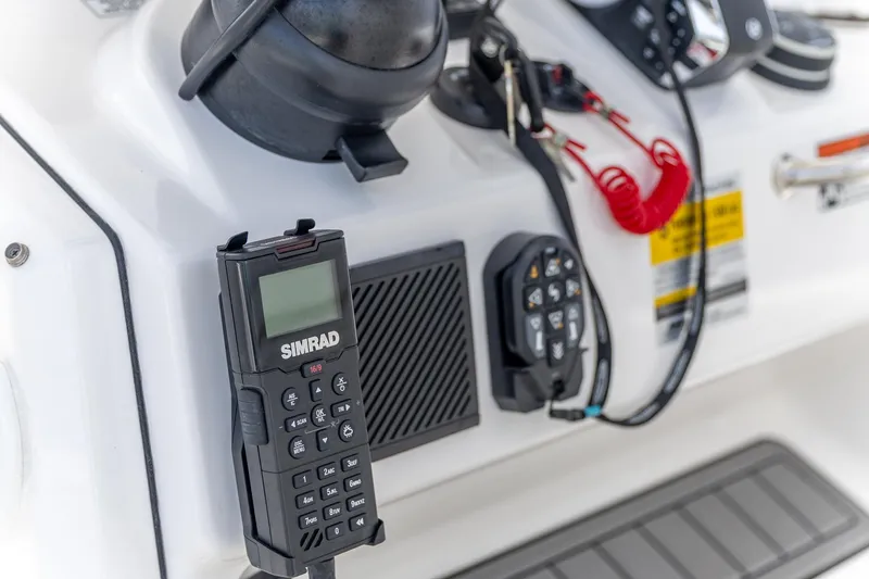 Slide: The Image of Control panel of 2025 Crevalle 24 HCO boat with Simrad radio and accessories. - 21