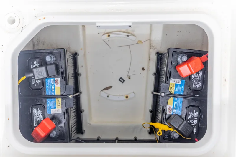 Slide: The Image of Battery compartment of 2025 Crevalle 24 HCO boat with dual deep cycle batteries. - 29