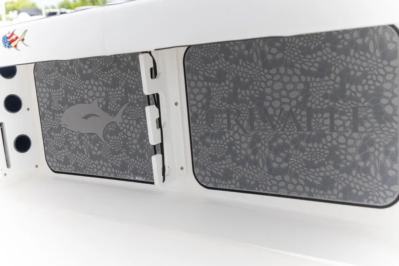 Slide: The Image of 2025 Crevalle 24 HCO boat with patterned panels and fish logo design. - 36