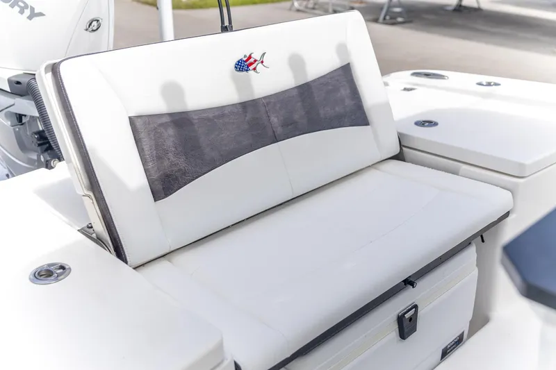 Slide: The Image of 2025 Crevalle 24 HCO boat seat with American flag fish logo. - 6