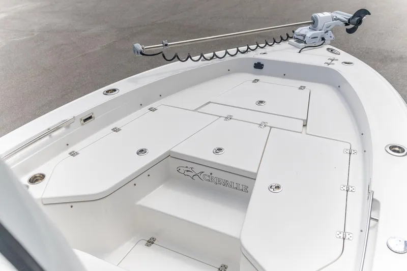 Slide: The Image of 2025 Crevalle 24 HCO boat deck with storage compartments and trolling motor. - 7