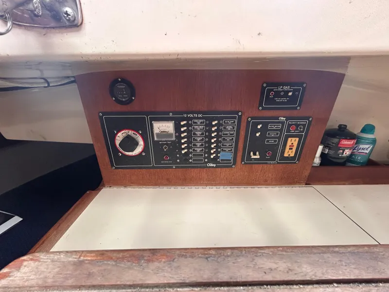 Slide: The Image of Control panel of a 1985 O'Day 35 sailboat with switches and gauges. - 11