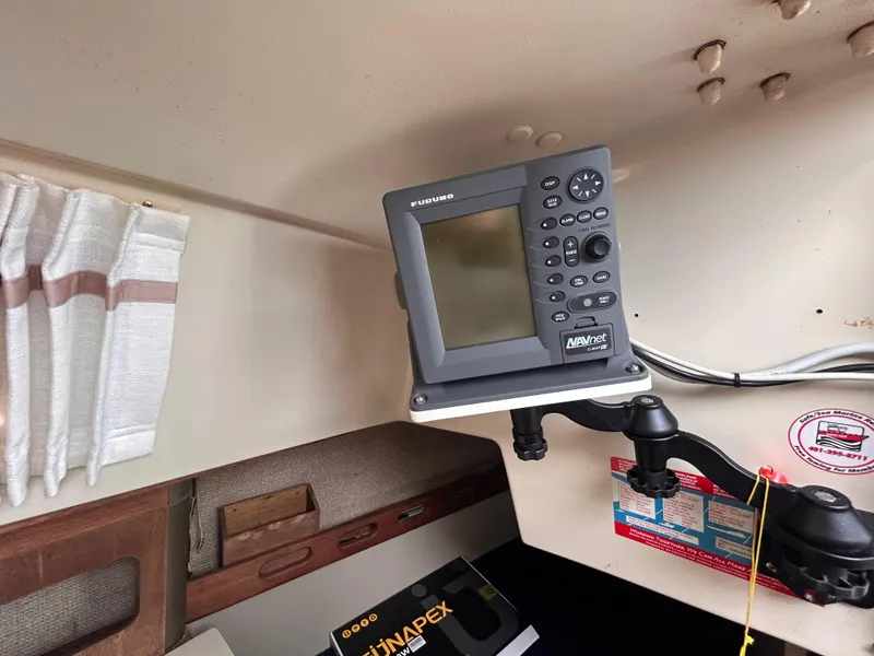 Slide: The Image of Navigation equipment inside a 1985 O'Day 35 sailboat cabin. - 20