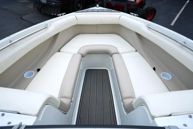 Slide: The Image of Interior of 1997 Cobalt 232 boat with beige seating and wood flooring. - 7