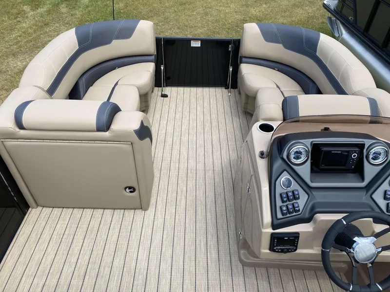 Slide: The Image of Luxurious 2025 Sylvan L1 LZ Tritoon interior with plush seating and modern helm controls. - 10