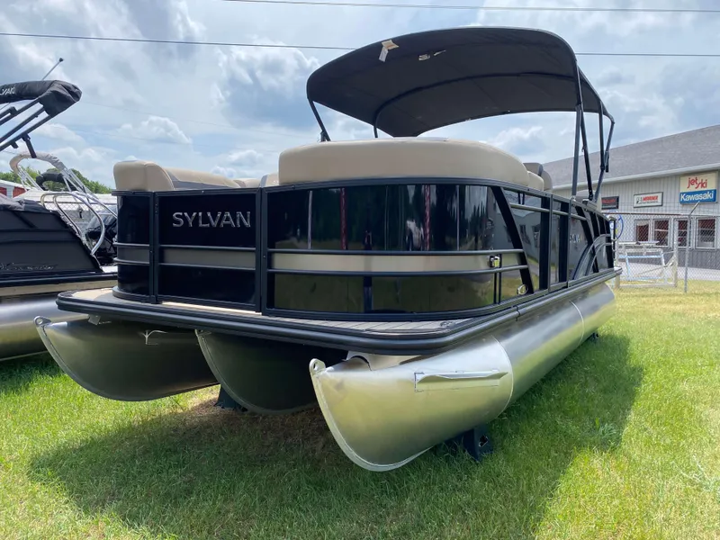 Slide: The Image of 2025 Sylvan L1 LZ Tritoon boat with Mercury 150HP engine on display outdoors. - 15