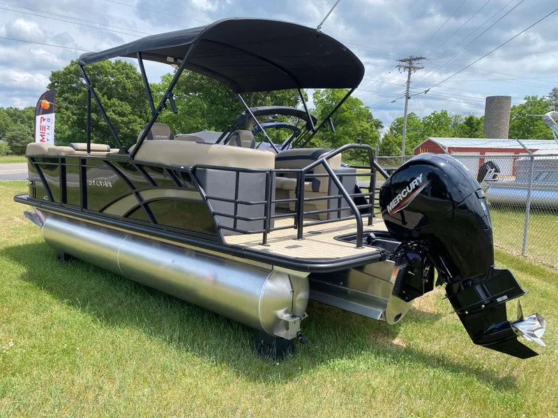 Slide: The Image of 2025 Sylvan L1 LZ Tritoon with Mercury 150HP engine on grassy area. - 19