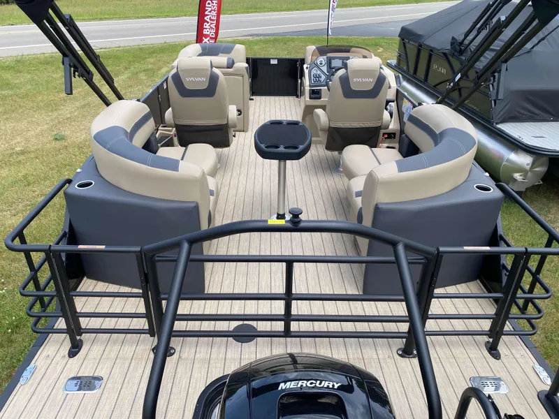 Slide: The Image of 2025 Sylvan L1 LZ Tritoon boat interior with Mercury 150HP engine, featuring spacious seating. - 2
