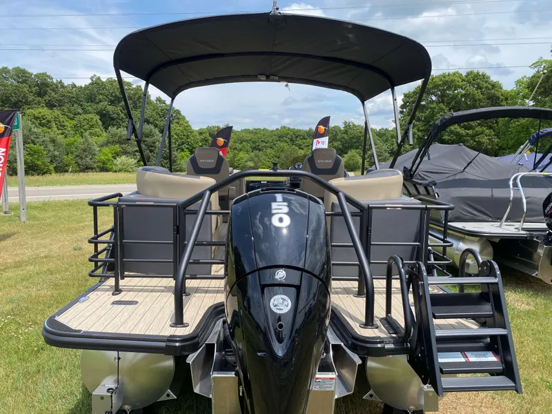 Slide: The Image of 2025 Sylvan L1 LZ Tritoon with Mercury 150HP engine, displayed outdoors. - 20