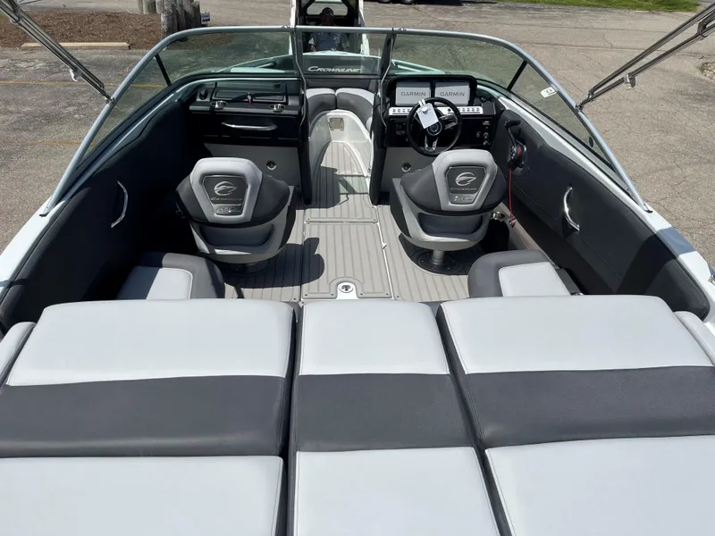 Slide: The Image of 2025 Crownline 220 SS boat interior with modern seating and dashboard. - 10