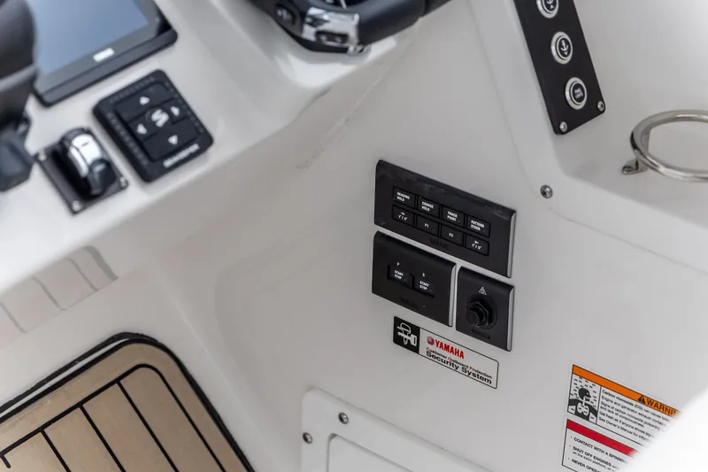 Slide: The Image of Control panel of 2026 Edgewater 262 CX boat featuring Yamaha security system. - 16