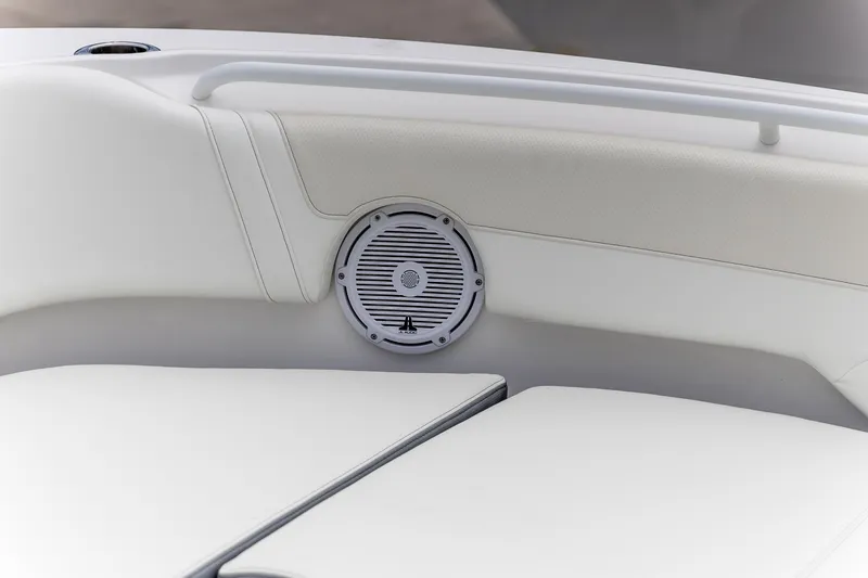 Slide: The Image of Edgewater 262 CX 2026 boat interior with speaker and white seating. - 29